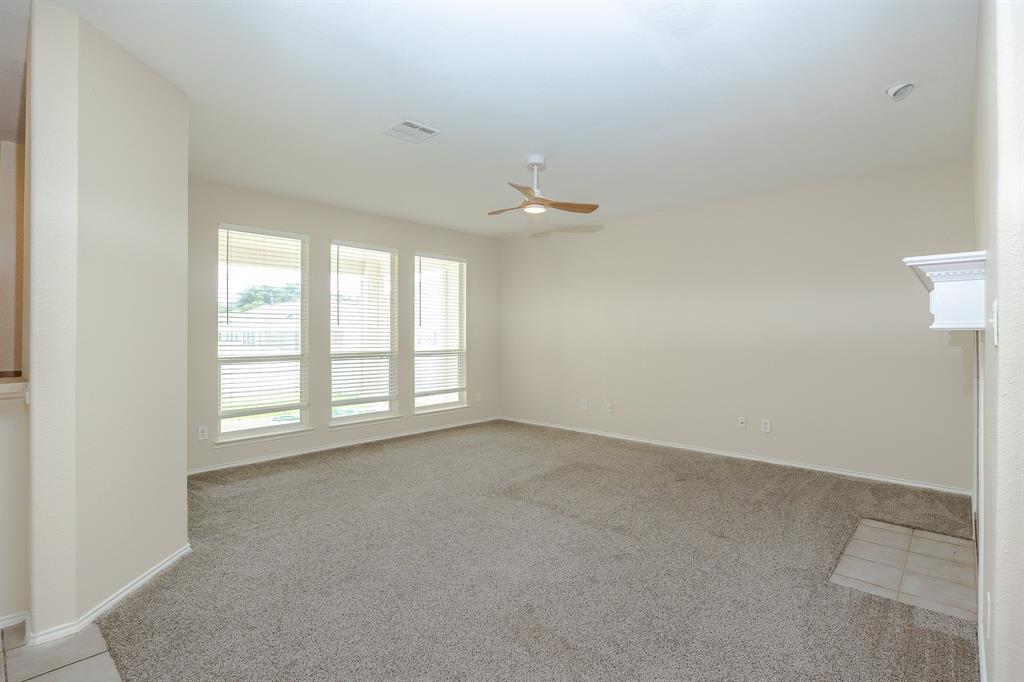 1828 Mercer Way Savannah, TX 76227 - Photo 12 of 38 Unfurnished room featuring light colored carpet and ceiling fan