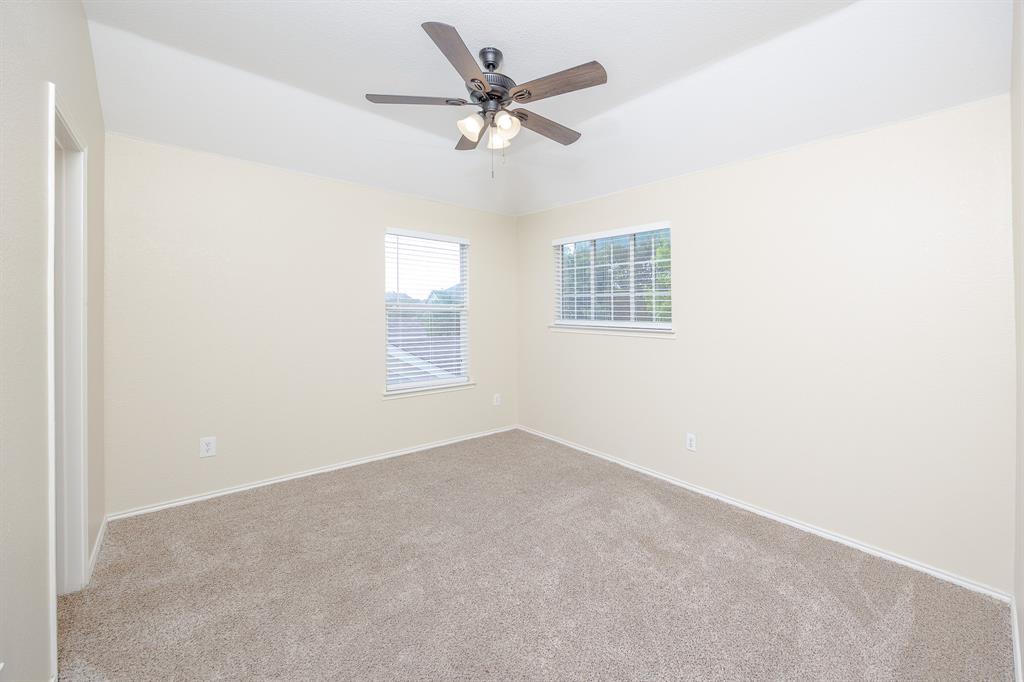 1828 Mercer Way Savannah, TX 76227 - Photo 19 of 38 Spare room featuring carpet floors and a ceiling fan