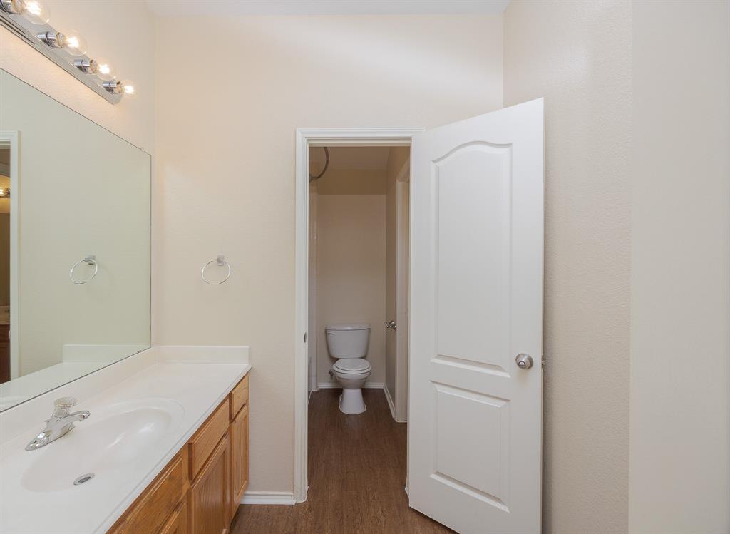 1828 Mercer Way Savannah, TX 76227 - Photo 25 of 38 Full bathroom featuring dark wood-style floors and vanity