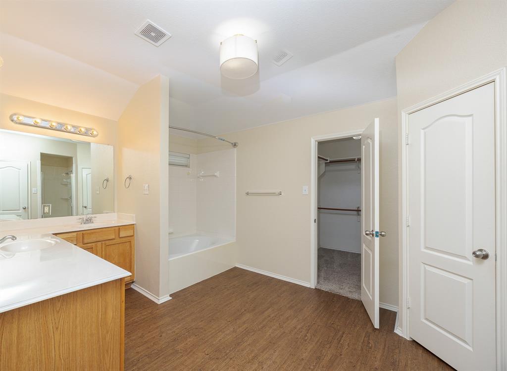 1828 Mercer Way Savannah, TX 76227 - Photo 26 of 38 Full bath featuring shower / bathtub combination, dark wood finished floors, vanity, and a spacious closet