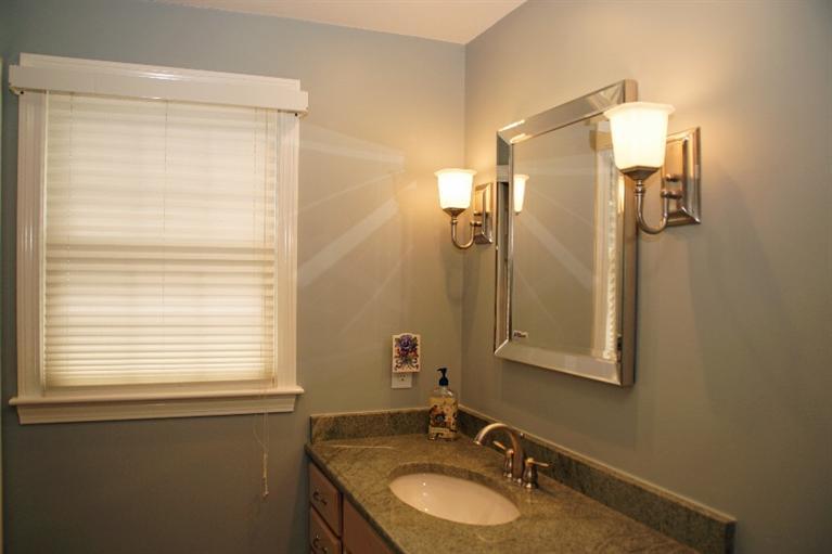23 Dundee Circle Harwich, MA 02645 - Photo 11 of 23 a bathroom with a granite countertop sink and a mirror