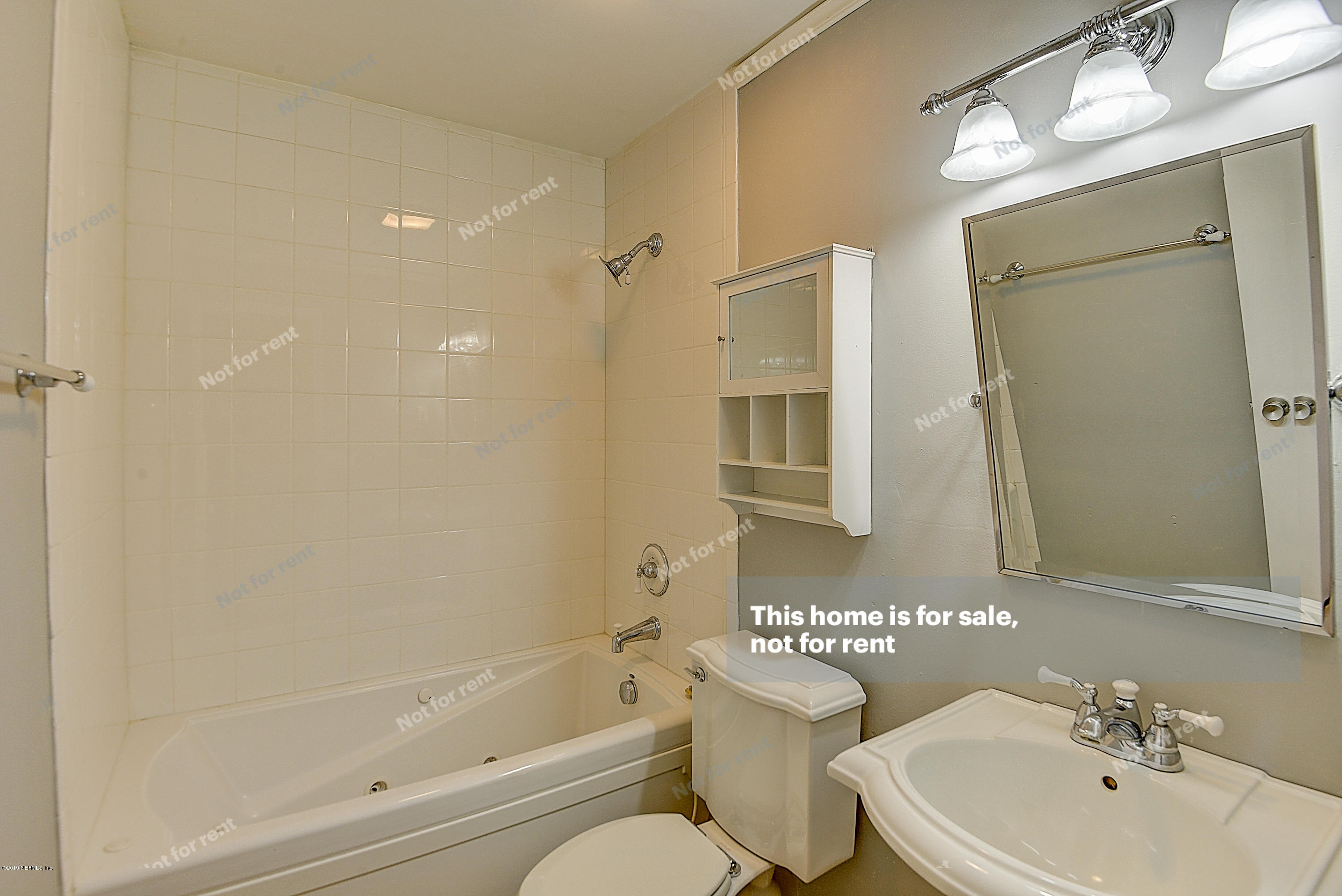 1152 Crown Drive Jacksonville, FL 32221 - Photo 16 of 31 a bathroom with a bathtub shower sink vanity and toilet