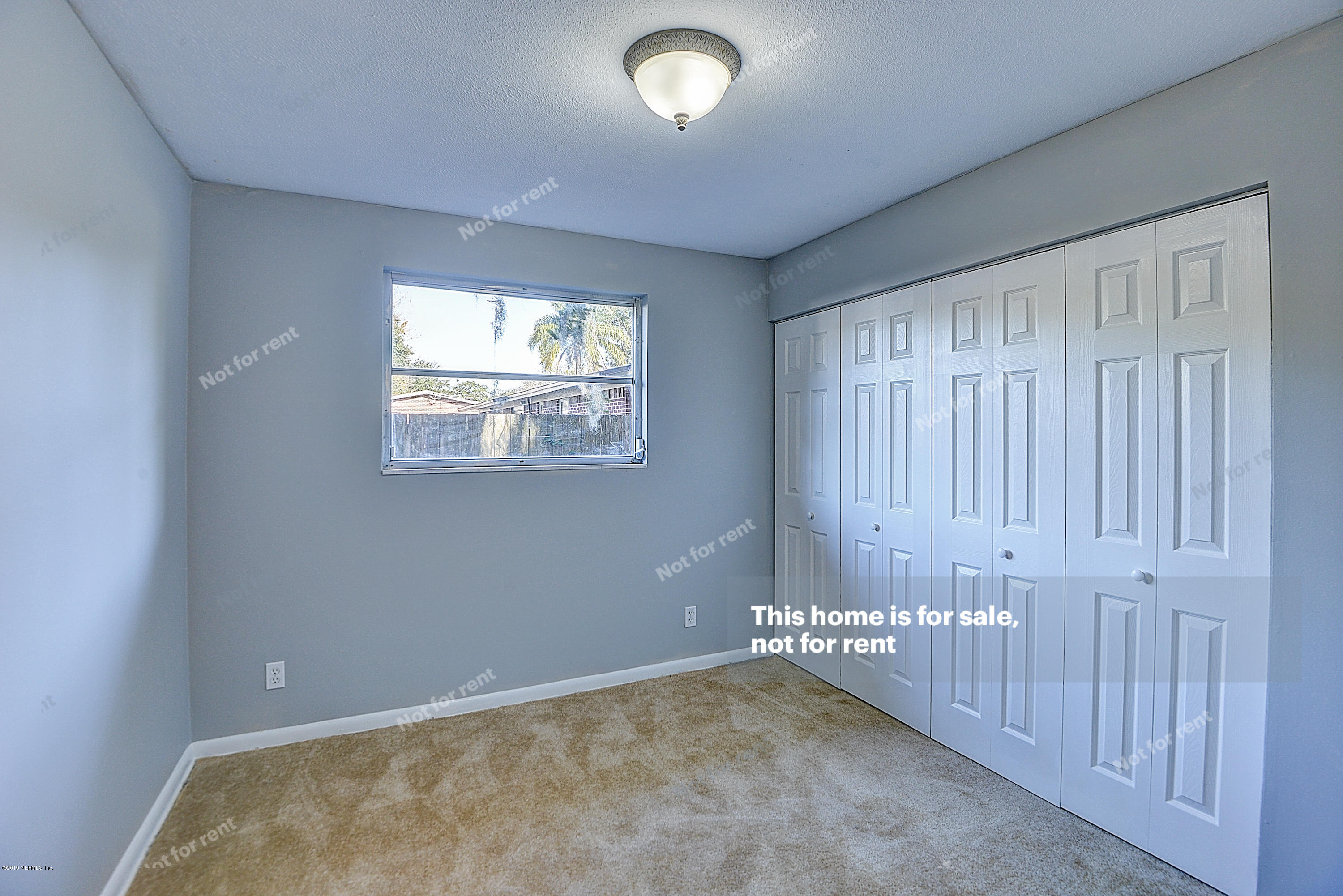 1152 Crown Drive Jacksonville, FL 32221 - Photo 17 of 31 an empty room with windows