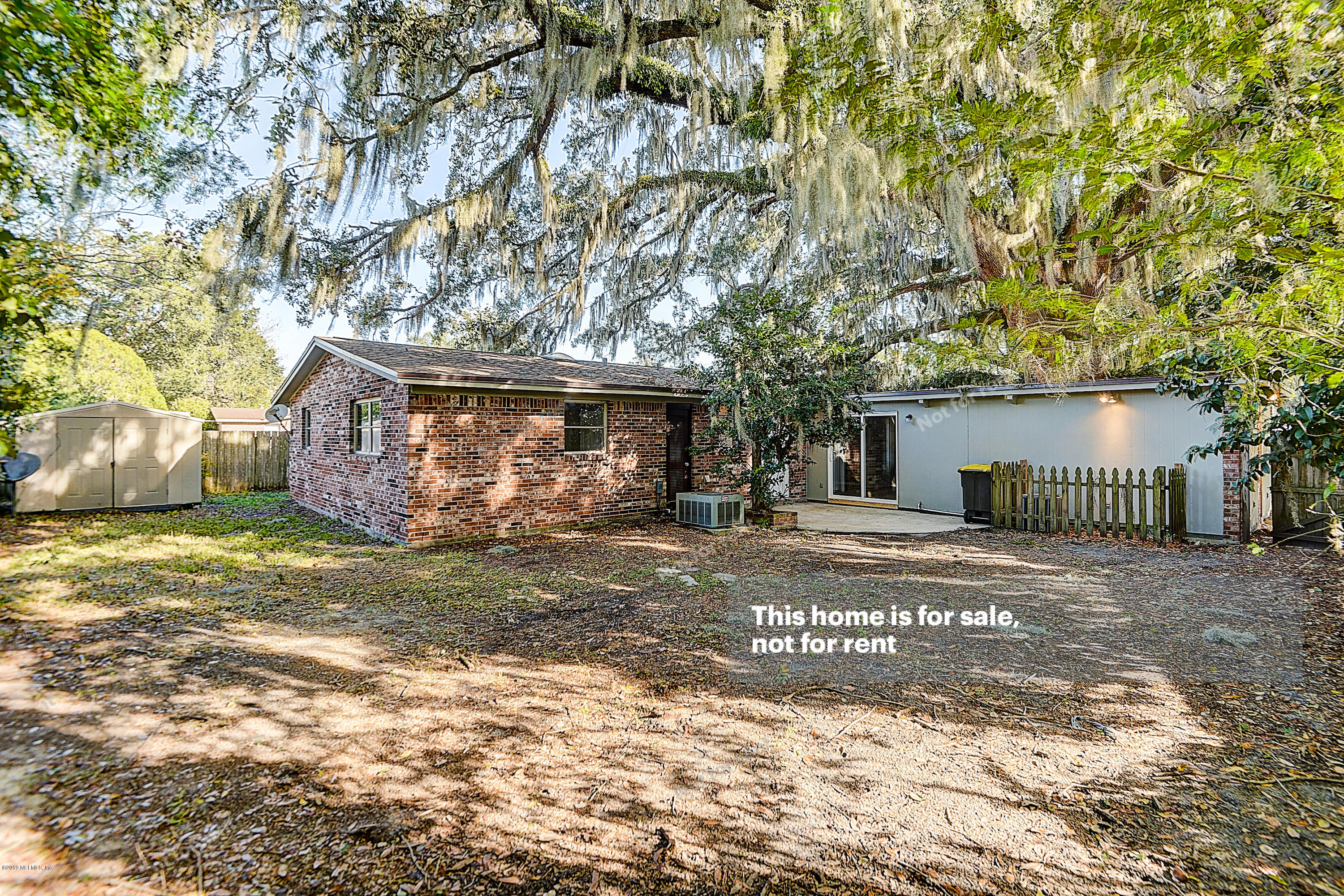 1152 Crown Drive Jacksonville, FL 32221 - Photo 6 of 31 a view of a house with a yard and garage