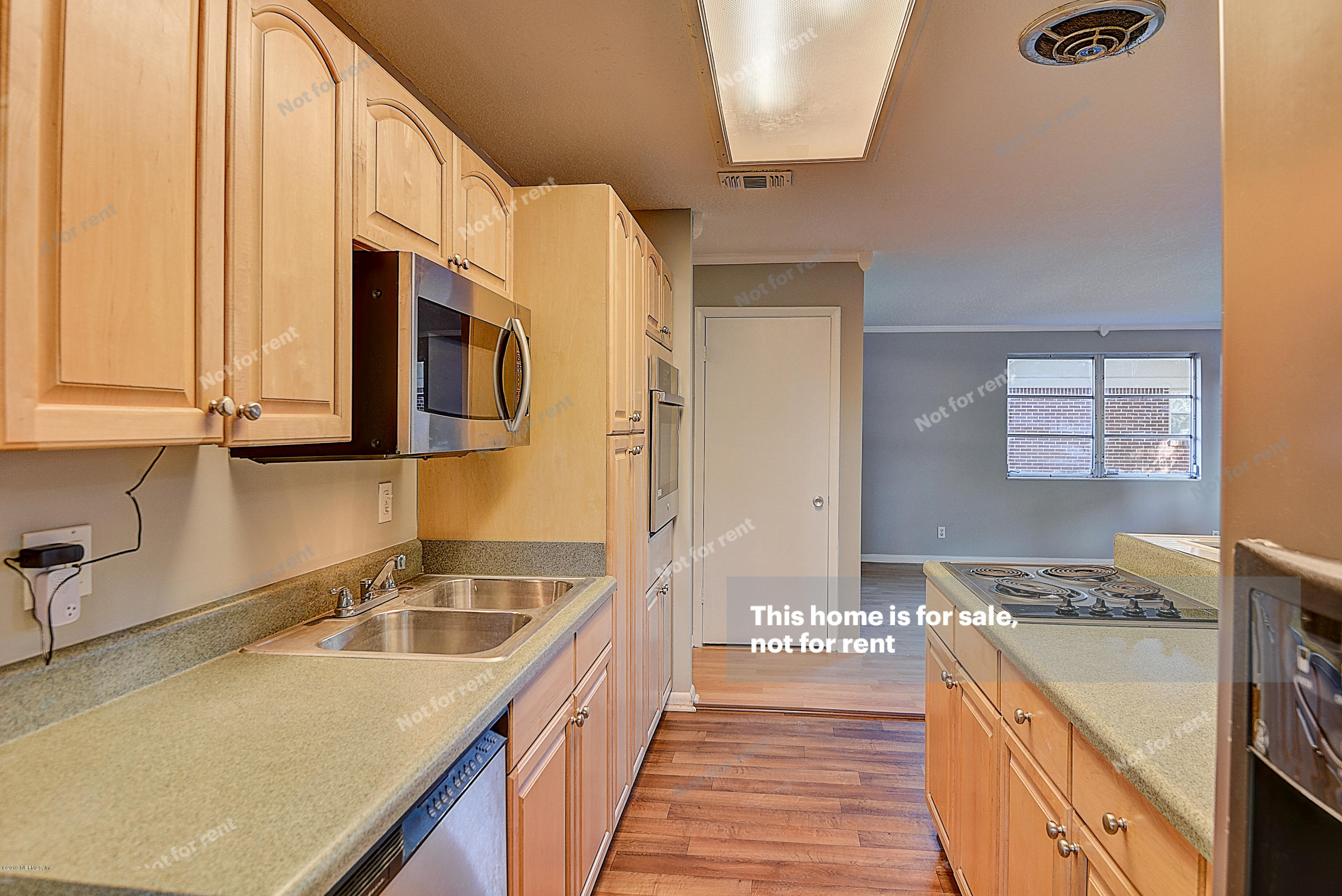 1152 Crown Drive Jacksonville, FL 32221 - Photo 9 of 31 a kitchen with stainless steel appliances granite countertop a sink a stove and a refrigerator
