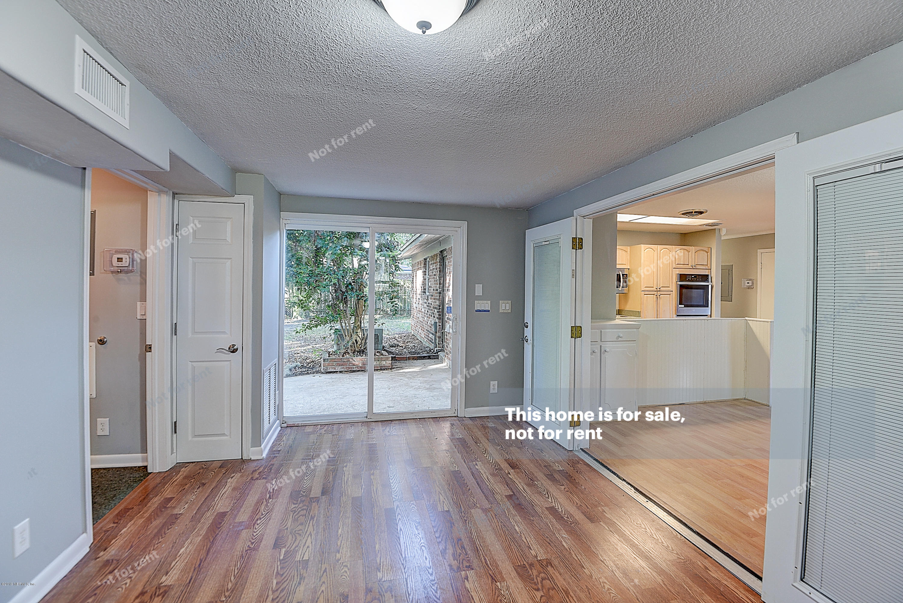 1152 Crown Drive Jacksonville, FL 32221 - Photo 10 of 31 a view of a room with wooden floor and windows