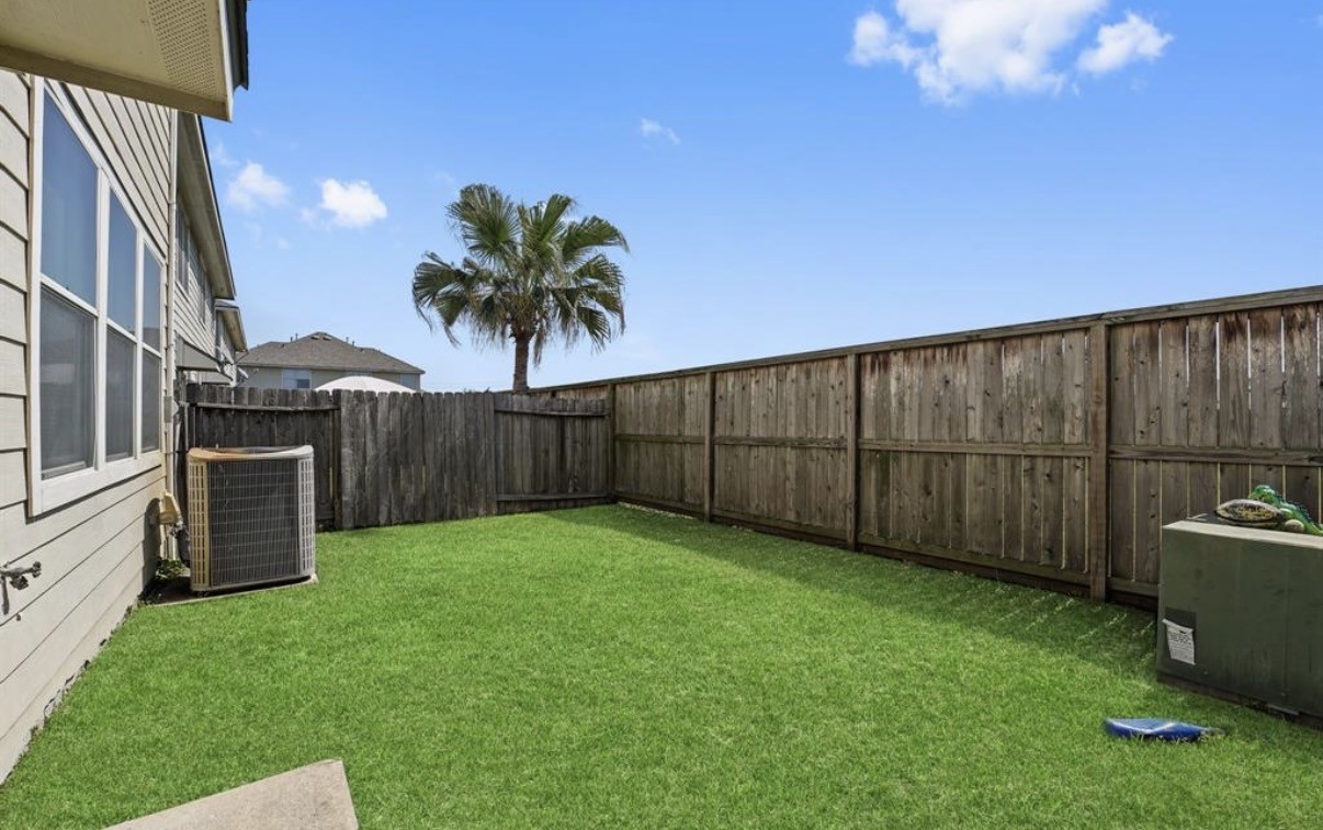 13134 Peppergate Lane Houston, TX 77044 - Photo 22 of 23 a view of a backyard with potted plants
