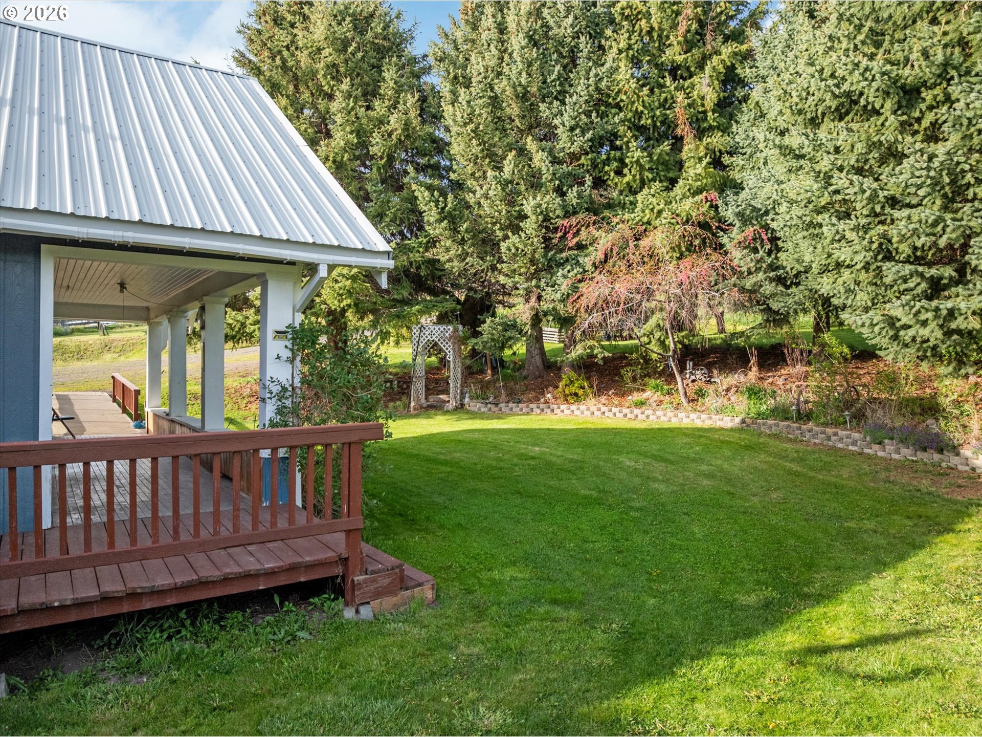 61938 High Valley Road Union, OR 97883 - Photo 30 of 46 a view of a house with a yard and sitting area