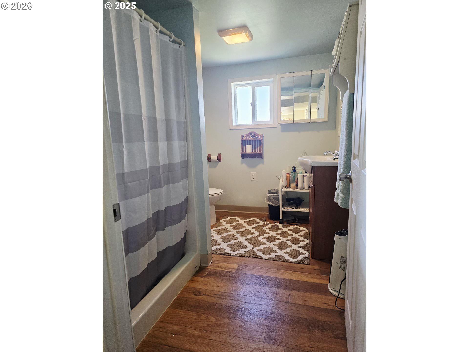 61938 High Valley Road Union, OR 97883 - Photo 41 of 46 a view of a hallway with wooden floor and a bathroom