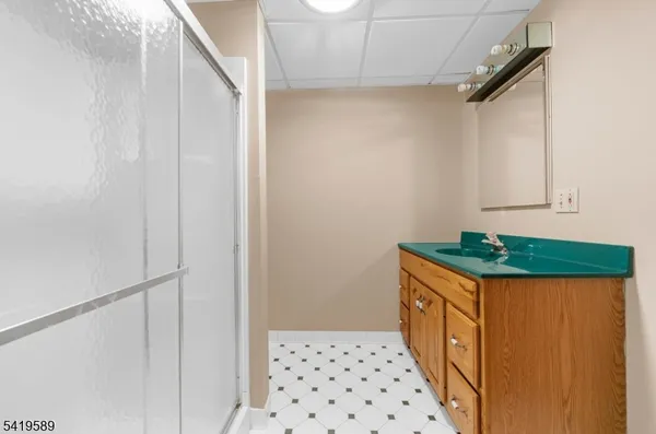 a room that has a bed and a table in it