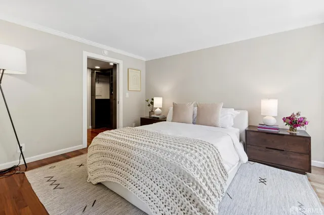 a bedroom with a bed and a dresser