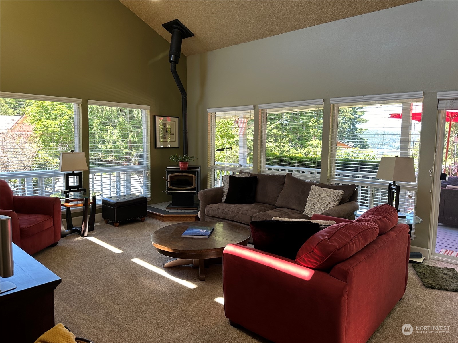 91 East Canyon View Road Belfair, WA 98528 - Photo 12 of 39 a living room with furniture and a fireplace