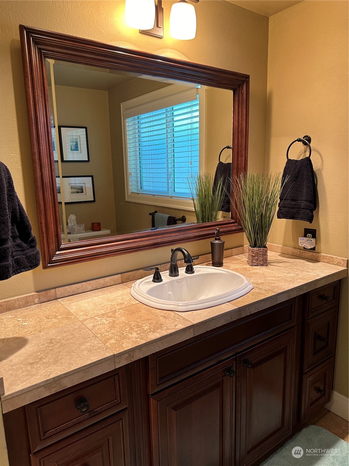 91 East Canyon View Road Belfair, WA 98528 - Photo 29 of 39 a bathroom with a sink and a mirror