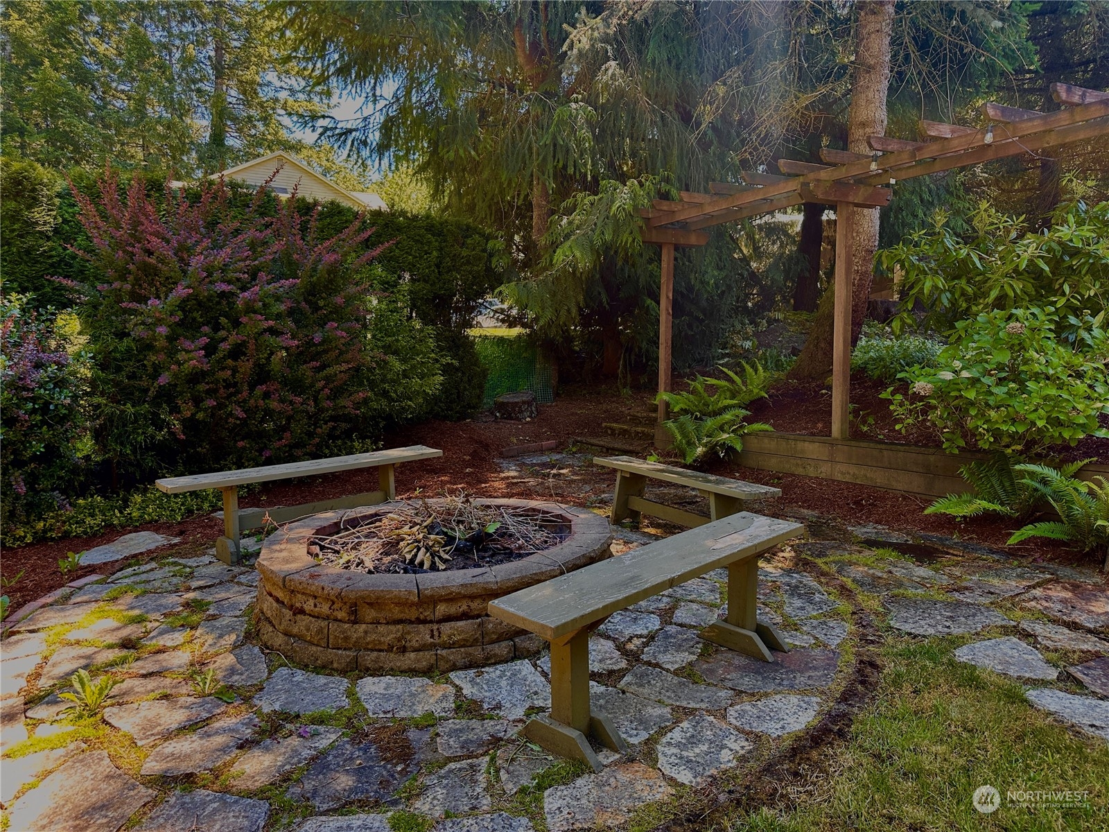 91 East Canyon View Road Belfair, WA 98528 - Photo 7 of 39 a view of a backyard with plants and a patio