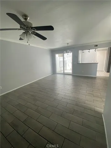 a view of a room with wooden floor and natural light