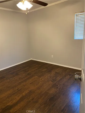 a bathroom with a granite countertop toilet and a sink