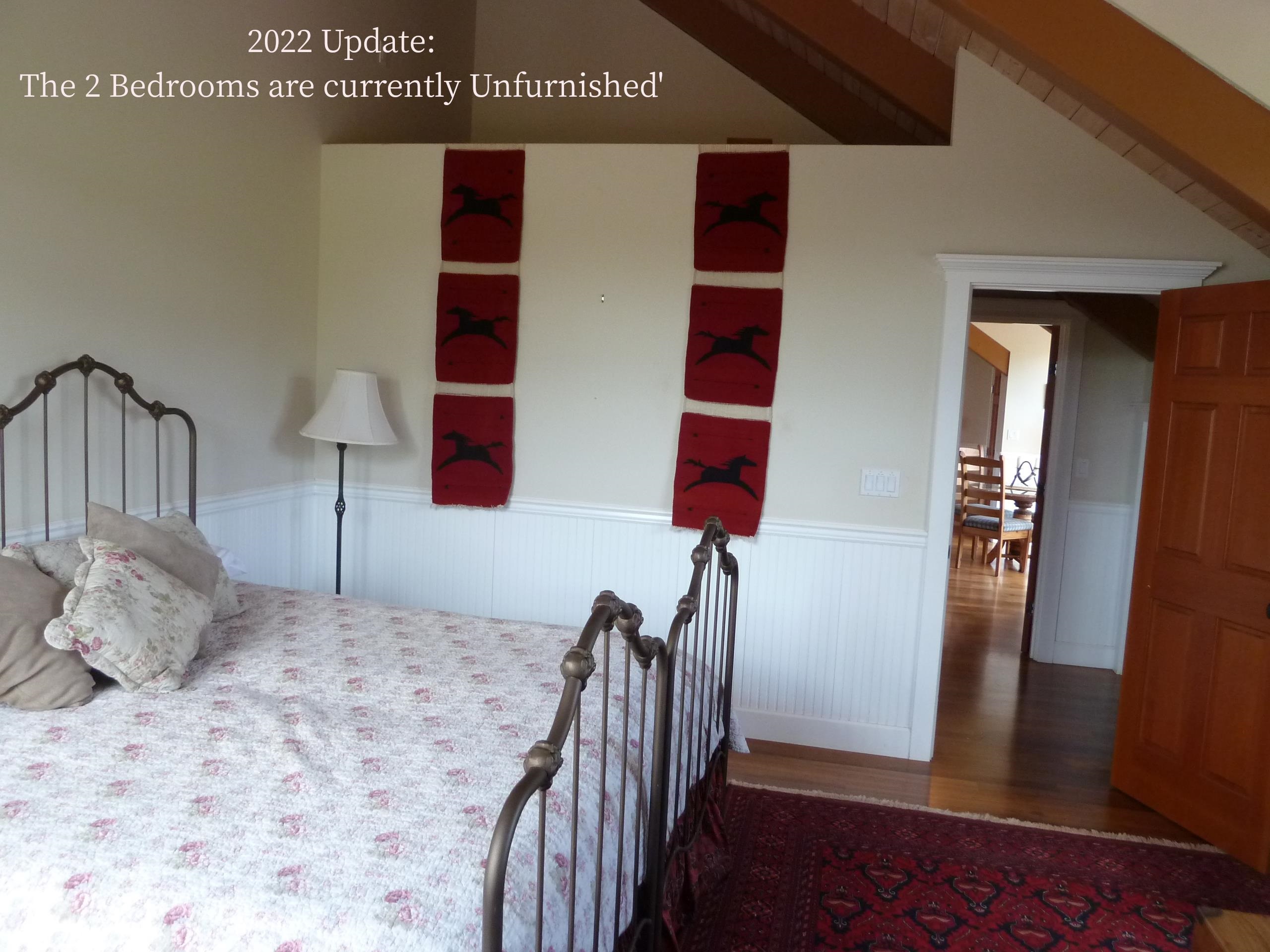 325 Waiahiwi Road Makawao, HI 96768 - Photo 11 of 30 a bedroom with a bed and wooden floor