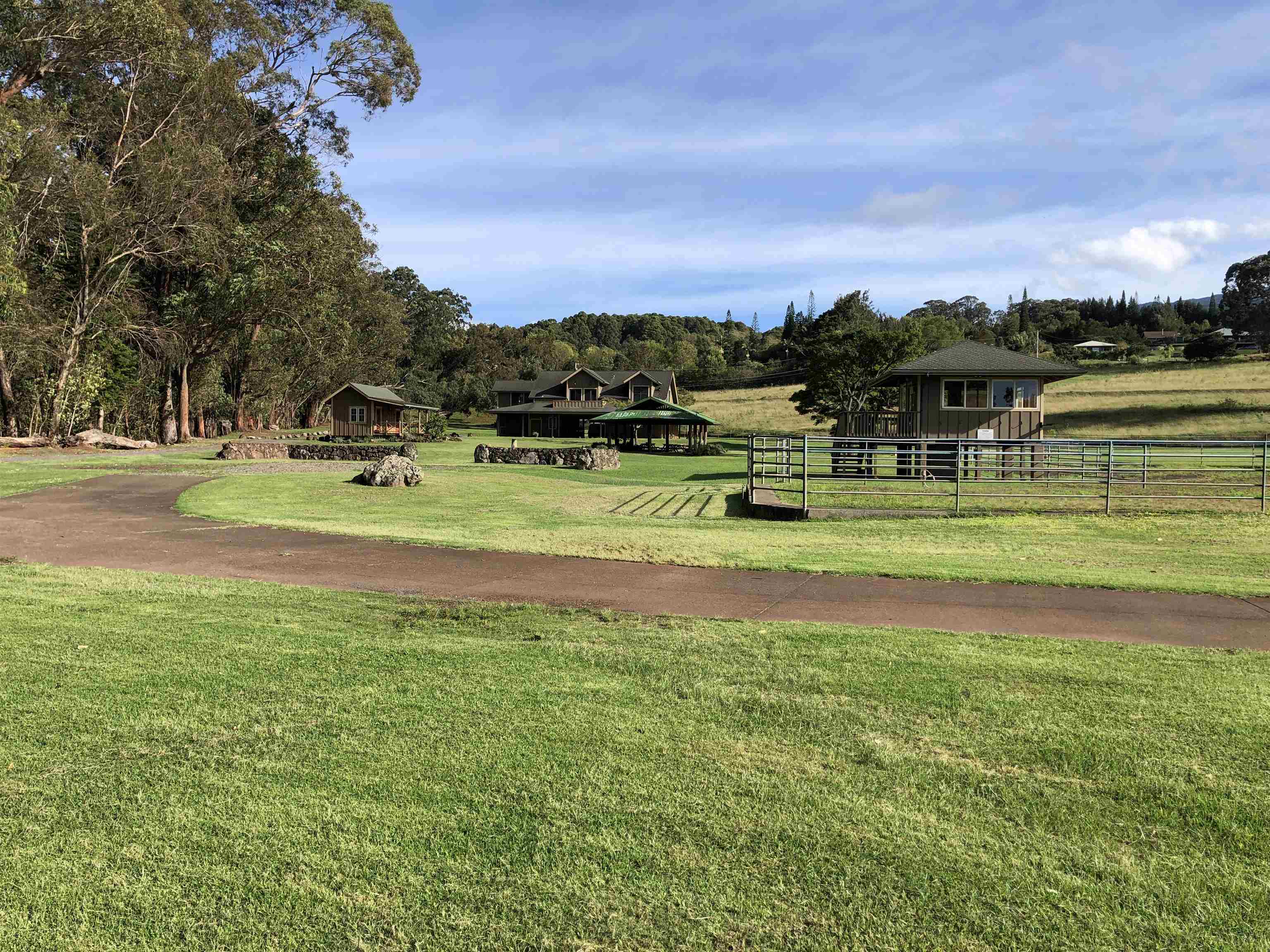 325 Waiahiwi Road Makawao, HI 96768 - Photo 16 of 30 a view of a golf course with a lake