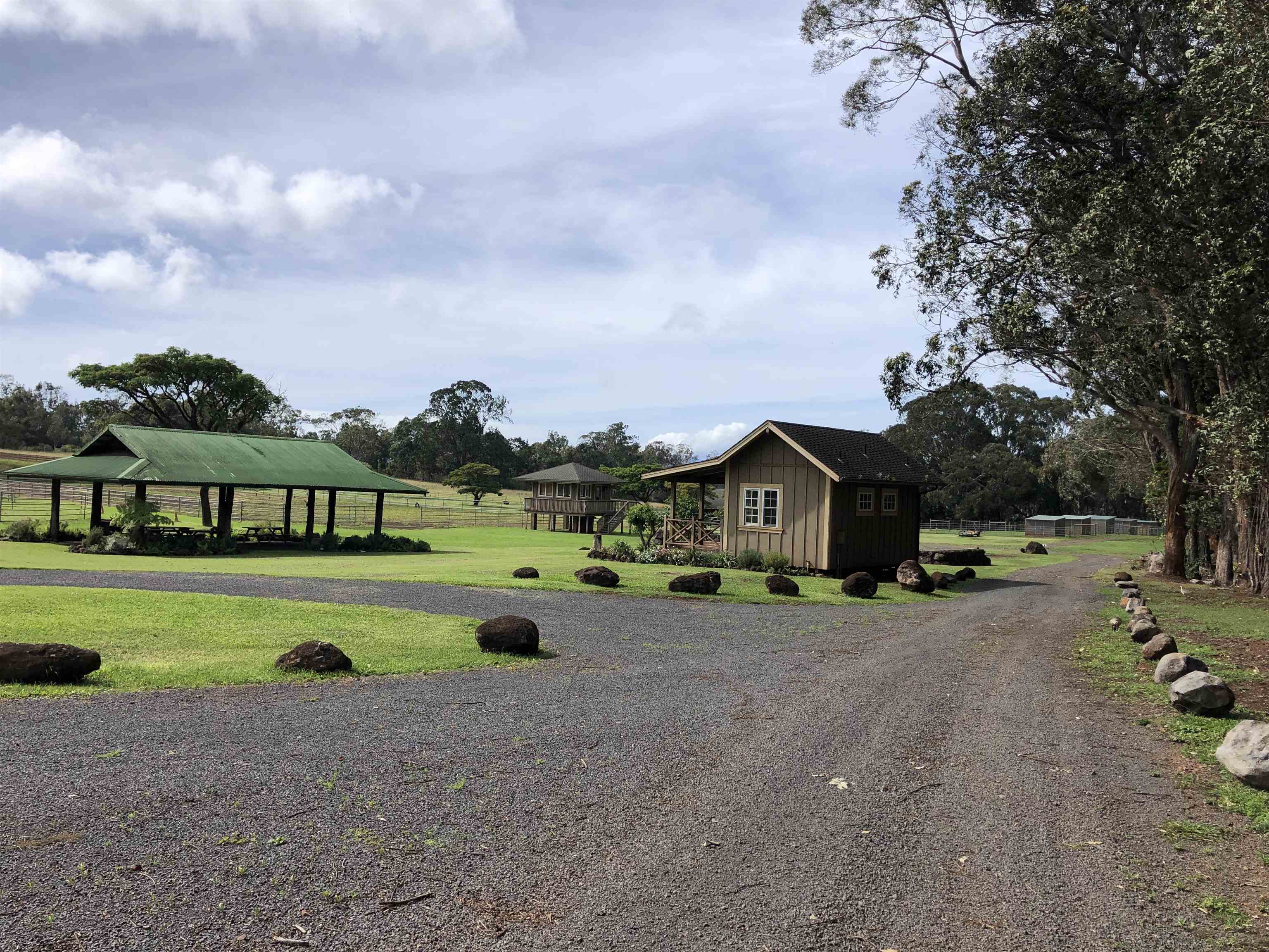 325 Waiahiwi Road Makawao, HI 96768 - Photo 21 of 30 a front view of a house with a yard and garage