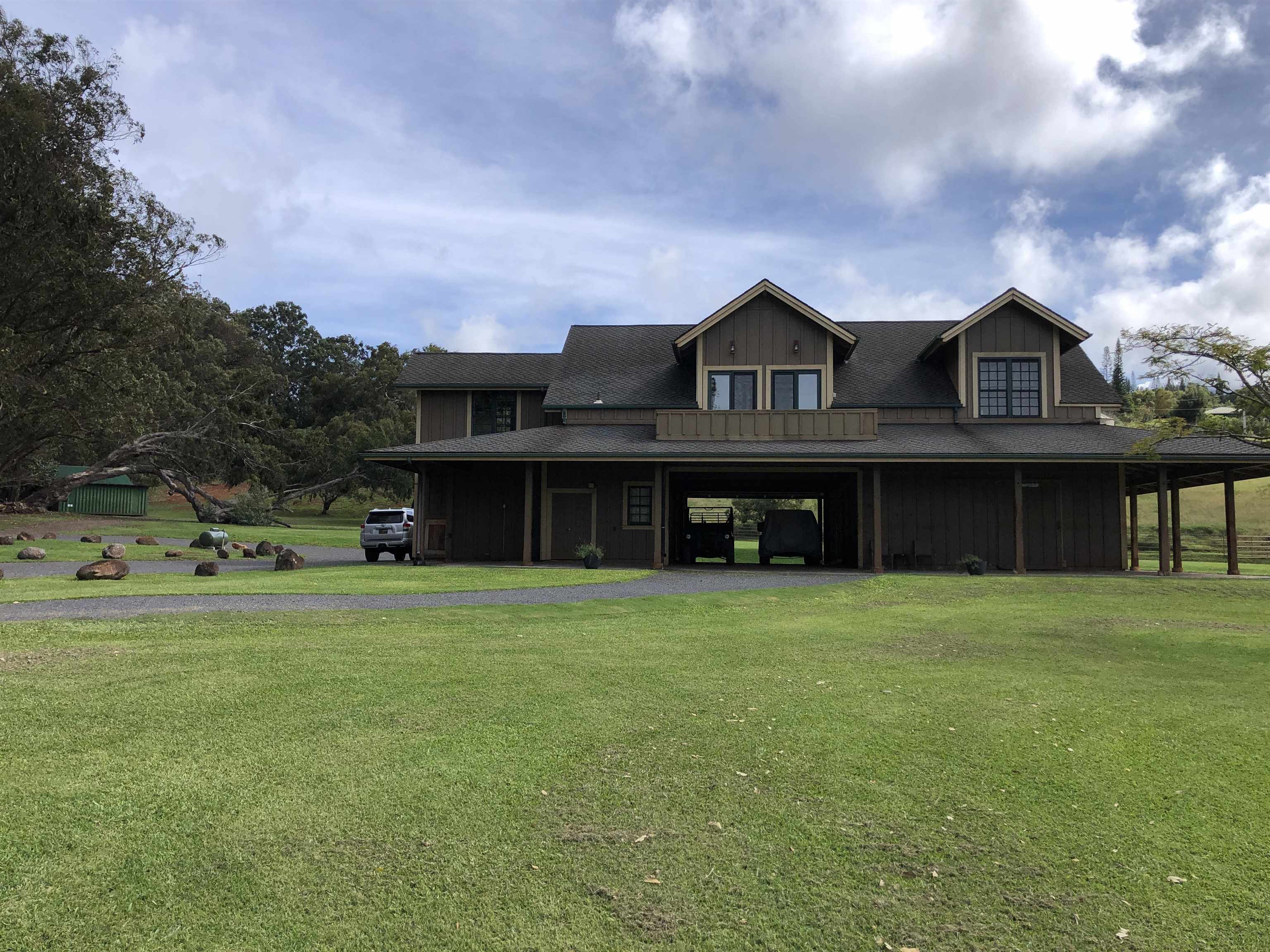 325 Waiahiwi Road Makawao, HI 96768 - Photo 24 of 30 a front view of a house with a garden