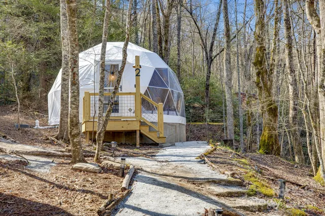 a bedroom with a bed a window and chair