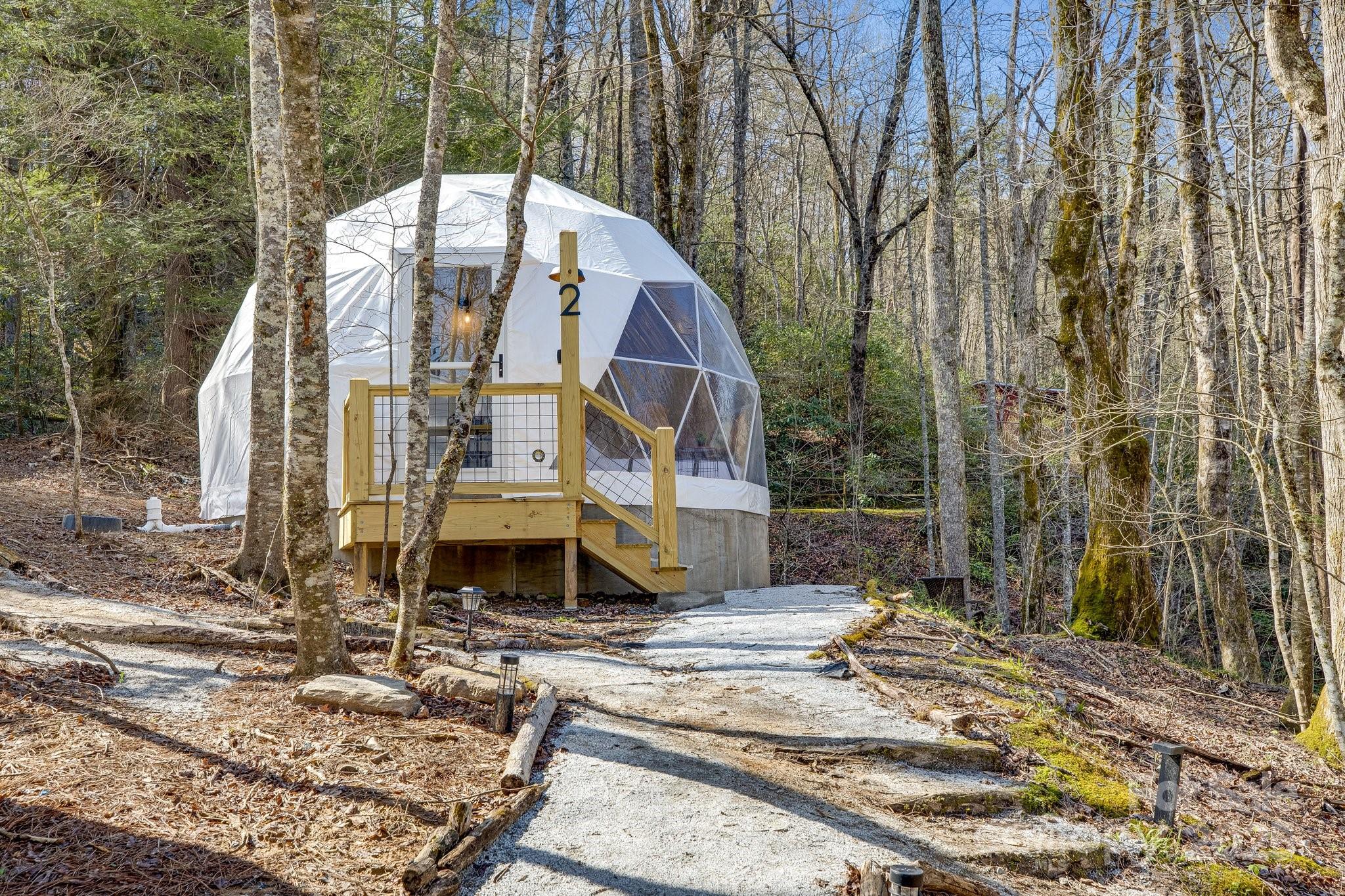 186 L Meece Road Rosman, NC 28772 - Photo 11 of 45 a aerial view of a house with a yard