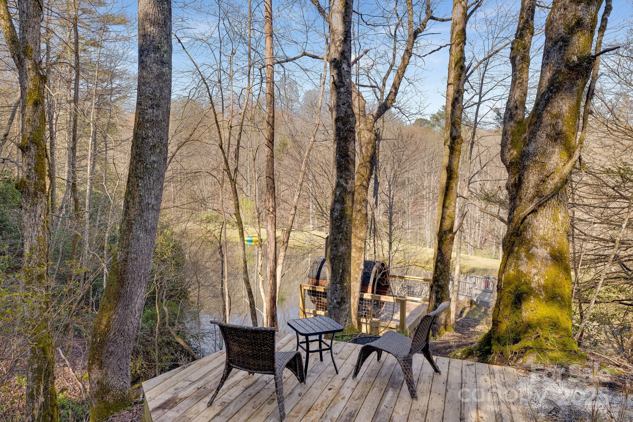 186 L Meece Road Rosman, NC 28772 - Photo 12 of 45 a view of a chairs and table on the deck