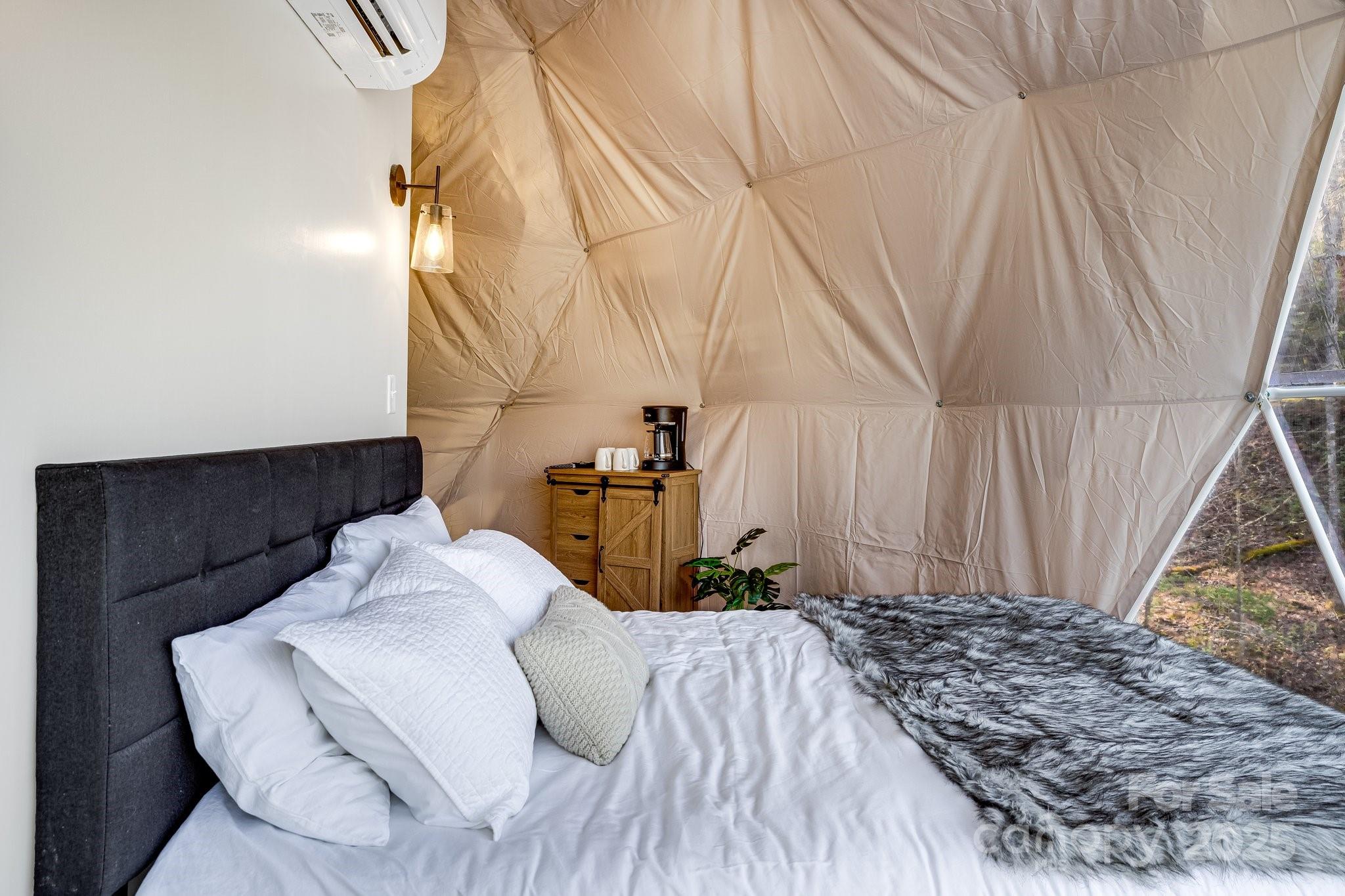 186 L Meece Road Rosman, NC 28772 - Photo 16 of 45 a bedroom with a bed and a window