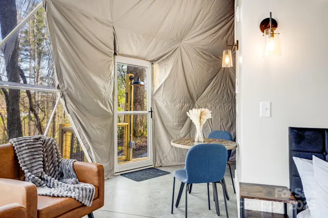 a bedroom with a bed and a mirror