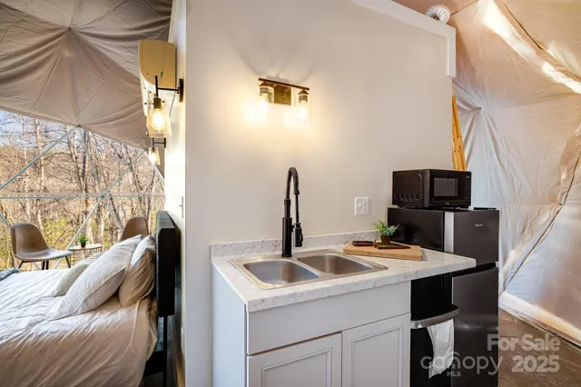 a bedroom with a bed and a potted plant