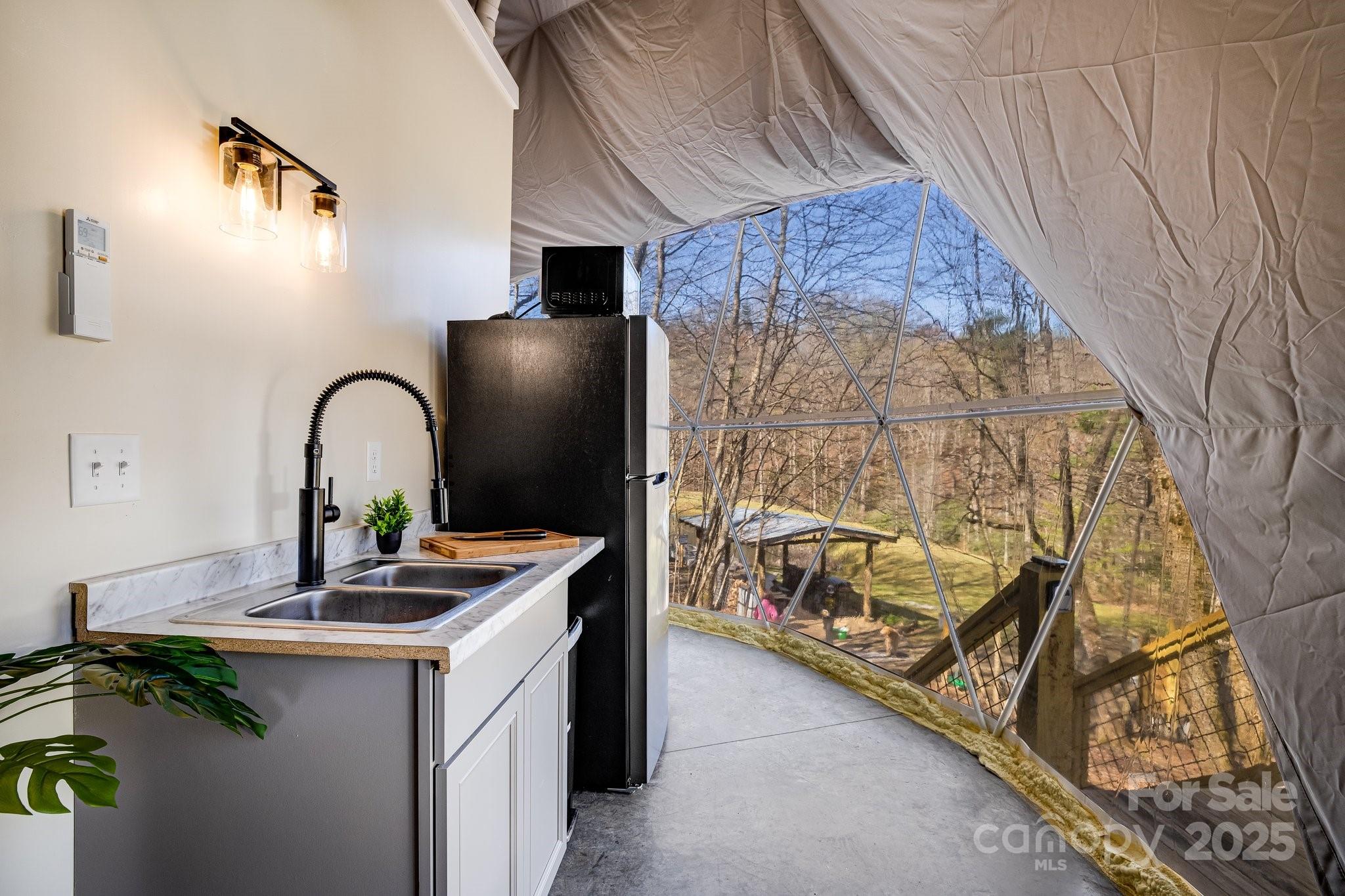 186 L Meece Road Rosman, NC 28772 - Photo 28 of 45 a kitchen with a sink and a stove
