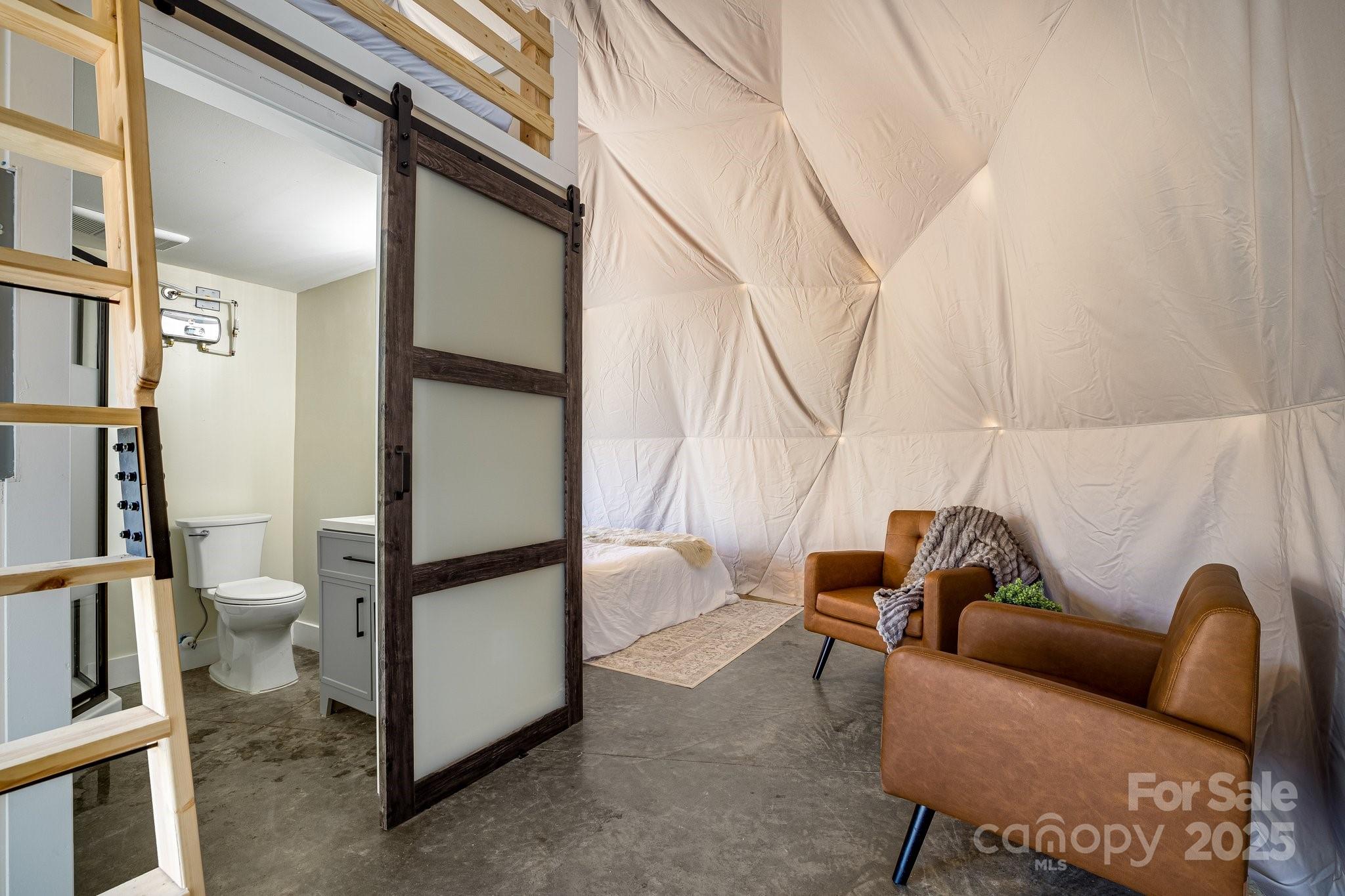 186 L Meece Road Rosman, NC 28772 - Photo 30 of 45 a living room with furniture a rug and white walls