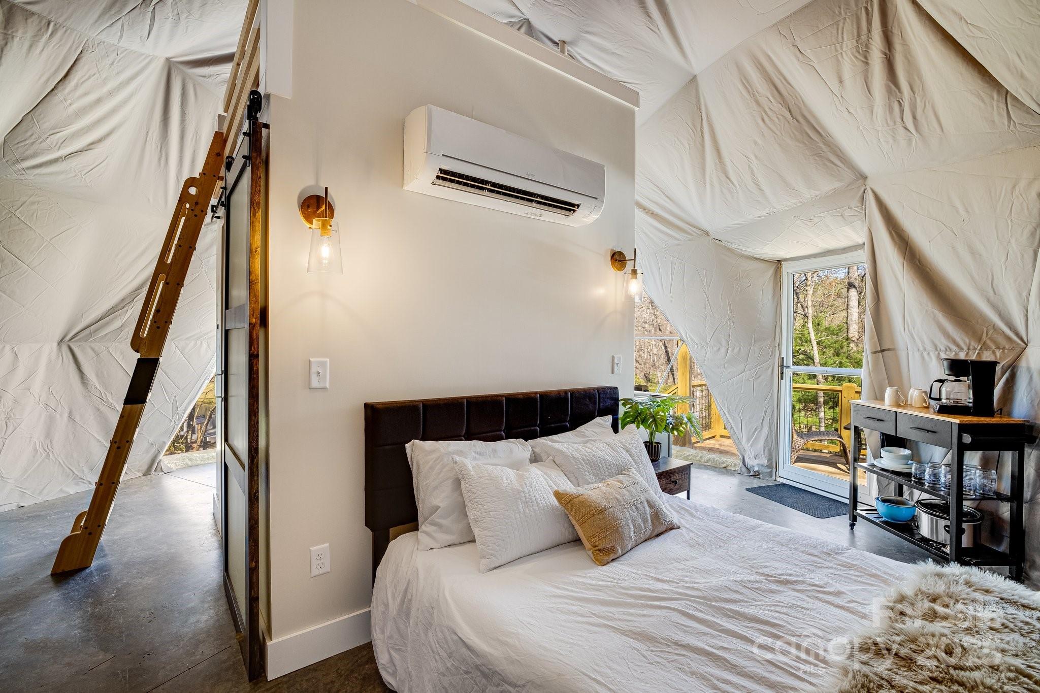 186 L Meece Road Rosman, NC 28772 - Photo 35 of 45 a bedroom with a bed a flat screen tv and a table