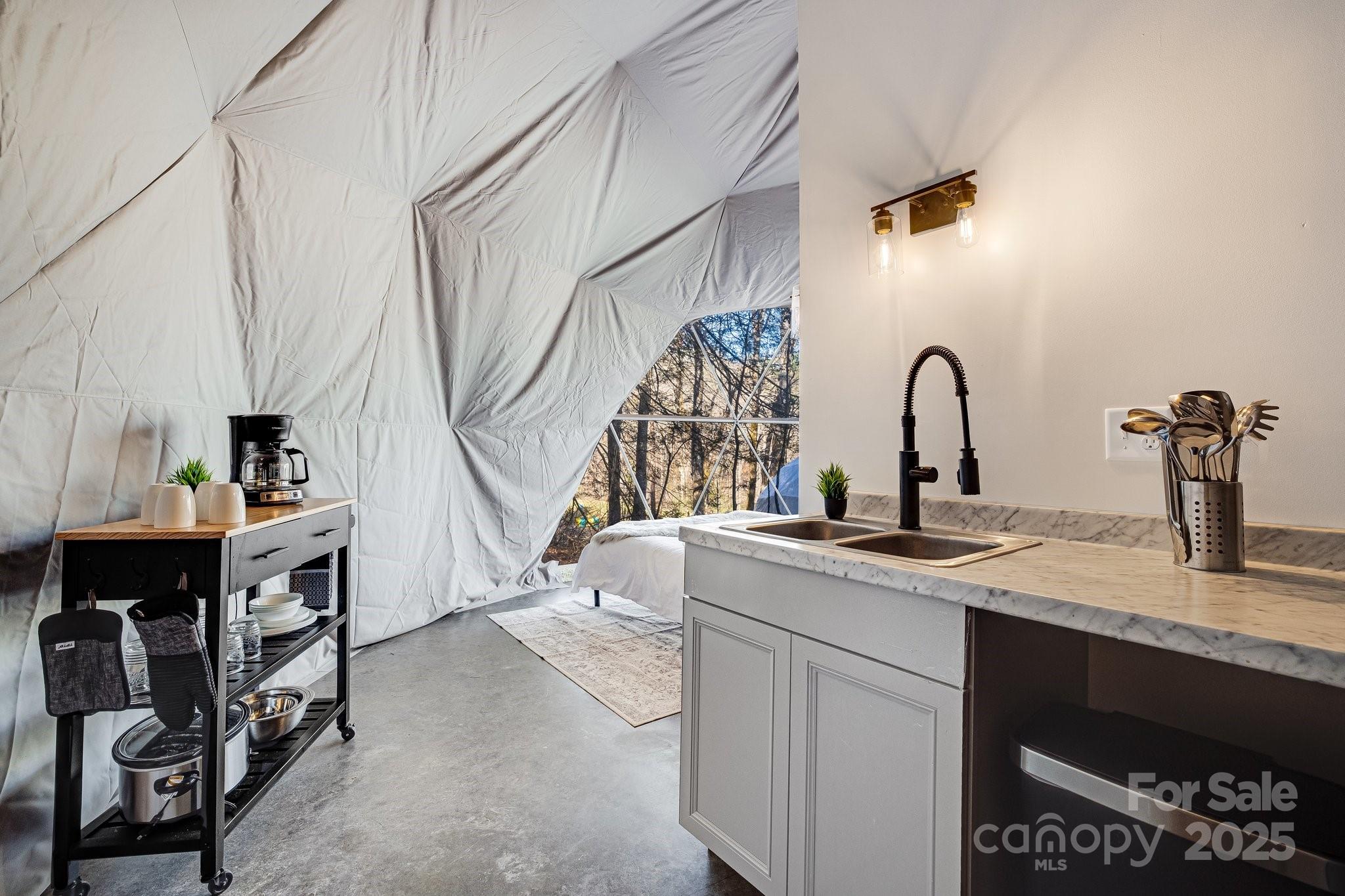 186 L Meece Road Rosman, NC 28772 - Photo 5 of 45 a kitchen with a sink a counter and a dining table
