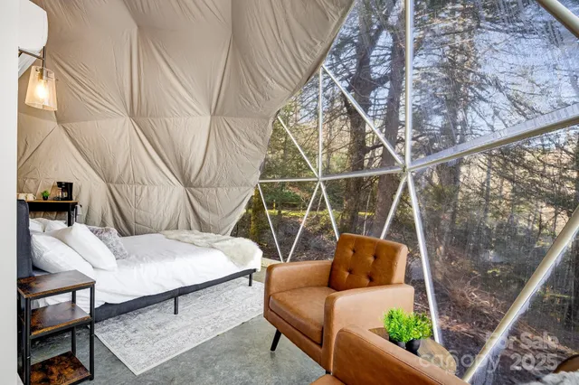 a view of living room with furniture and floor to ceiling window