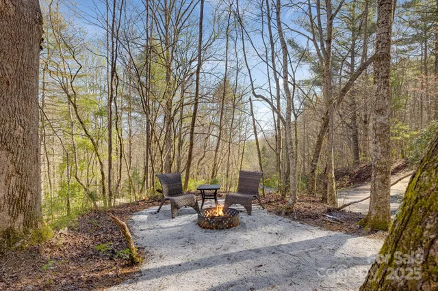 a view of a chairs and table on the deck