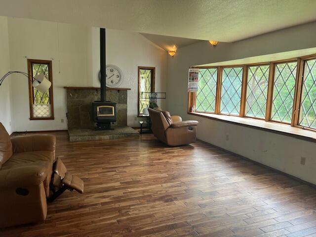 4196 East Evans Creek Road Rogue River, OR 97537 - Photo 12 of 36 a living room with furniture and a fireplace