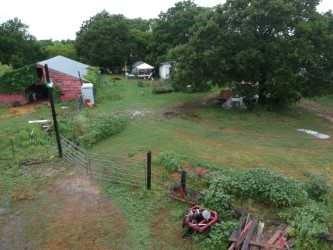 4708 Pioneer Road Balch Springs, TX 75180 - Photo 2 of 7 a backyard of a house with lots of green space