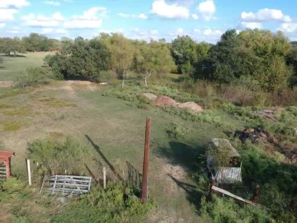 4708 Pioneer Road Balch Springs, TX 75180 - Photo 4 of 7 a view of a dry yard with green space