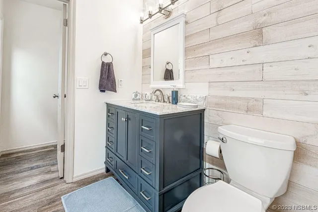 a kitchen with stainless steel appliances granite countertop a stove and a microwave