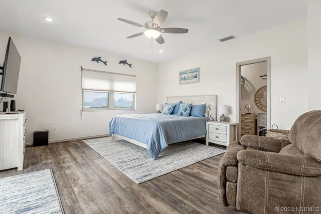 a living room with a fireplace and a flat screen tv