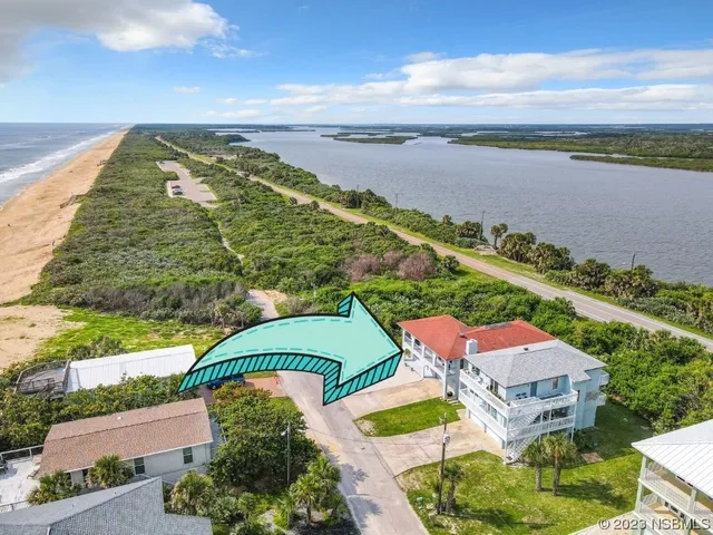 a kitchen with granite countertop white cabinets and a sink
