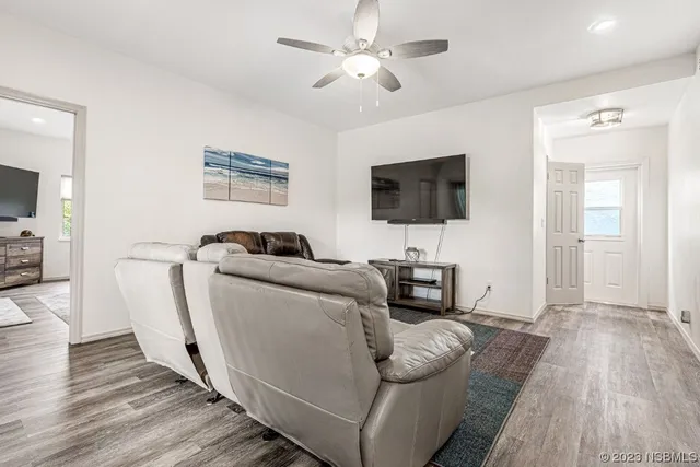 a bathroom with a toilet sink vanity and mirror