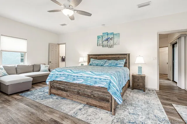 a view of a dining room with furniture and a chandelier