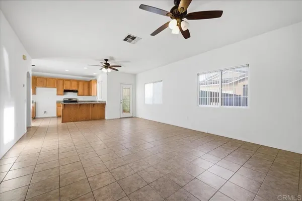 a view of a kitchen with a sink and a window