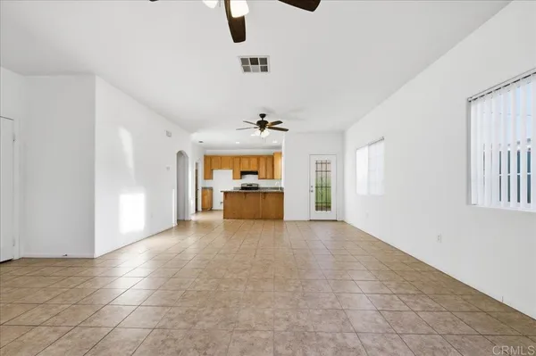 a view of a kitchen with a sink and a window