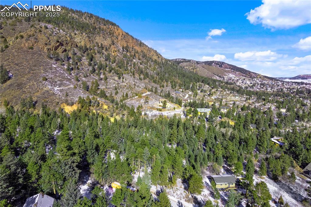0 Rock Ridge Road Palmer Lake, CO 80133 - Photo 7 of 7 a view of a large building with a mountain in the background