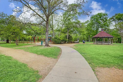 a sign that is in front of flowers
