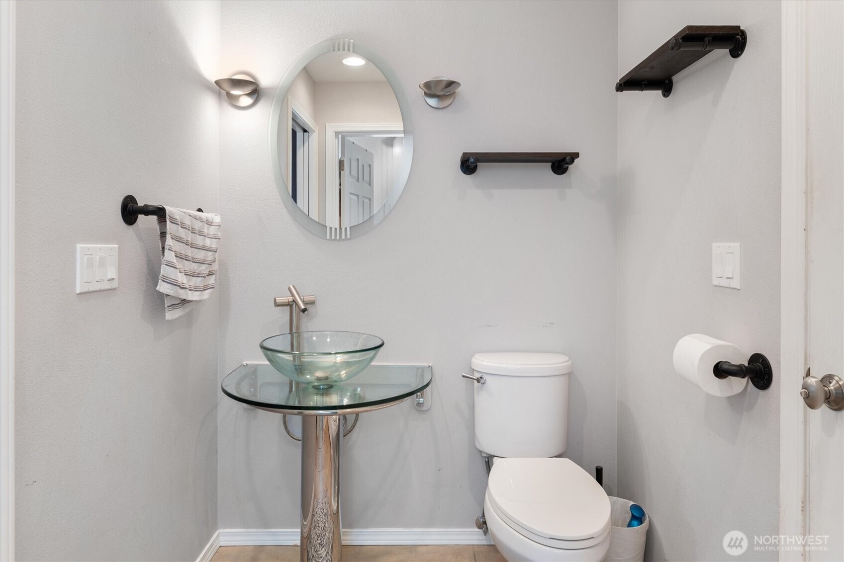 17018 45th Street East Lake Tapps, WA 98391 - Photo 14 of 40 a bathroom with a toilet a sink and mirror
