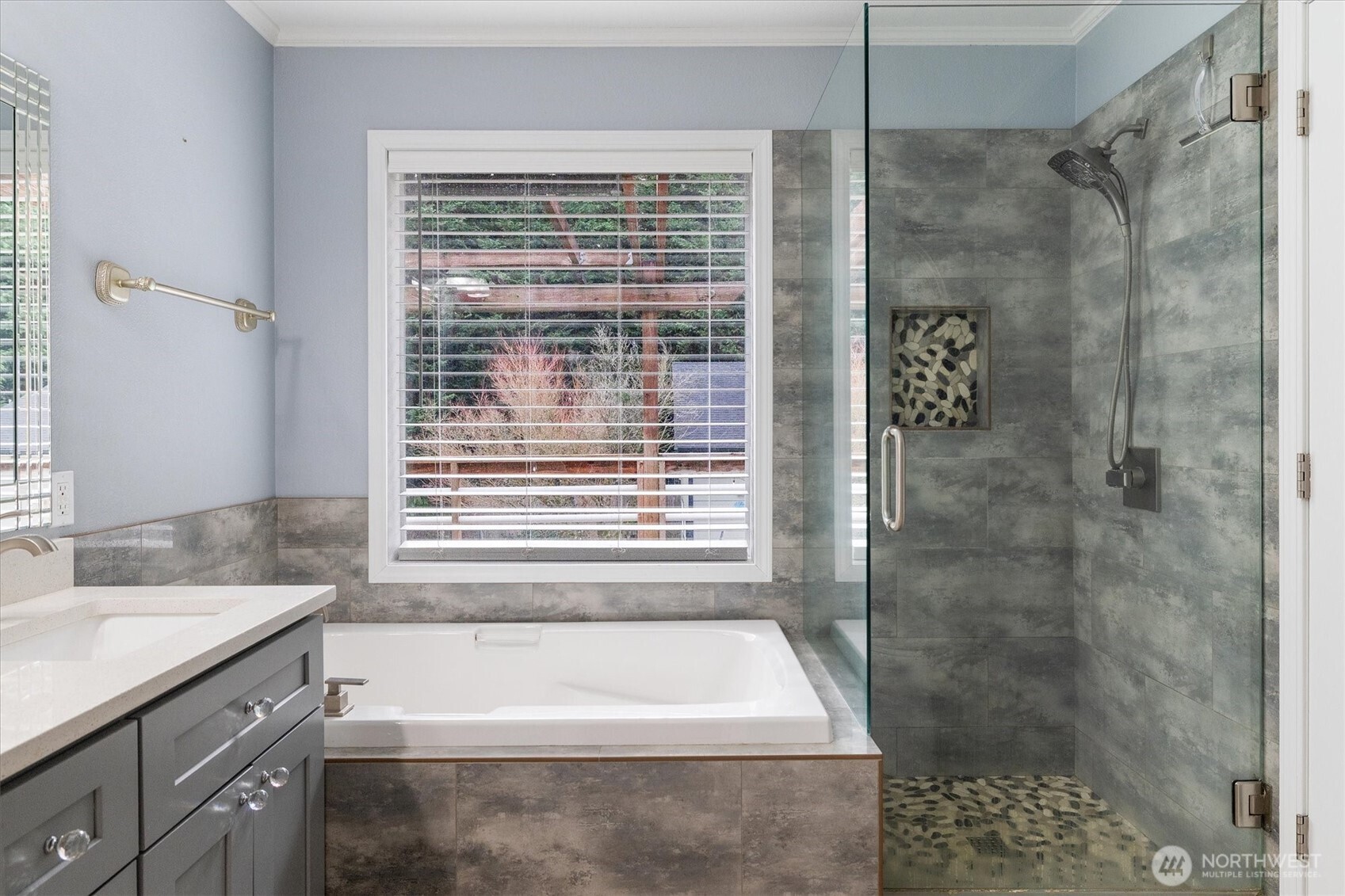 17018 45th Street East Lake Tapps, WA 98391 - Photo 21 of 40 a bathroom with a bathtub a shower and a sink